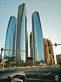 Low angle view of modern buildings against sky