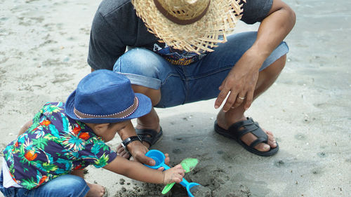 High angle view of father and son at beach