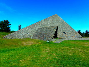 Built structures against clear blue sky