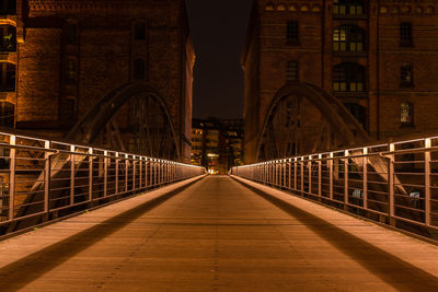 Illuminated bridge at night