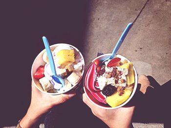 Cropped image of hand holding ice cream