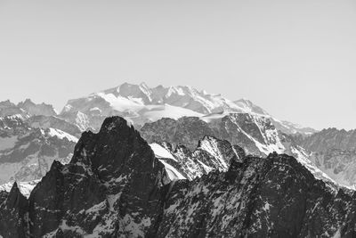 Scenic view of snowcapped mountains against clear sky