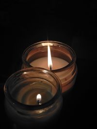 High angle view of tea light candle in darkroom