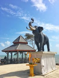 Low angle view of statue against sky