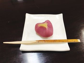 High angle view of heart shape on white table