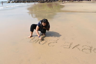 Full length of woman on beach