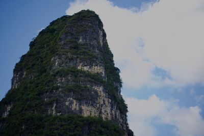 Low angle view of rock formation against sky