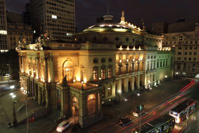 High angle view of illuminated street and buildings at night