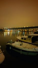 View of illuminated boats at night