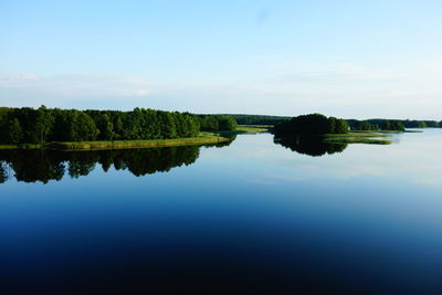 Scenic view of lake against blue sky