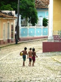 Children playing in front of building