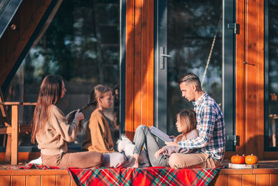 Group of people sitting on table