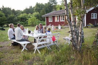 Family having meal in garden, oland, sweden