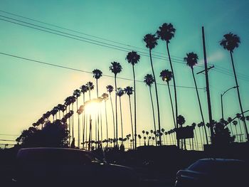 Low angle view of road against sky at sunset