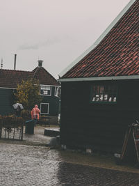 Houses against sky during rainy season