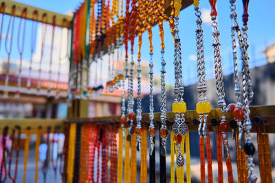 Rosary beads hanging at middle eastern bazaar. colorful prayer beads at street vendor's display