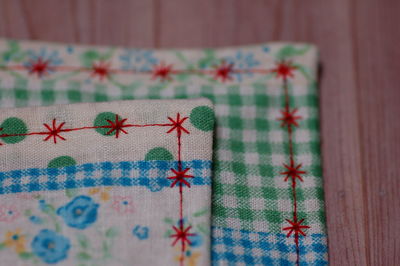 Close-up of fabrics on wooden table