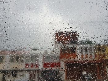 Raindrops on glass window of rainy season