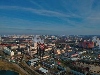 High angle view of buildings in city against sky