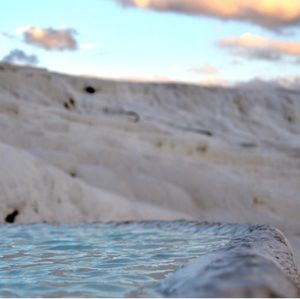 Close-up of beach against sky