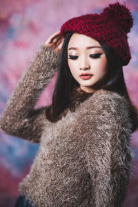 Portrait of woman in hat during winter