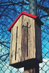 Low angle view of wooden structure against sky