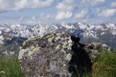 Close-up of rocks on rock against sky