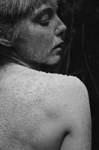 Close-up of topless woman with flour