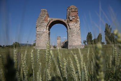 Low angle view of old ruins against sky