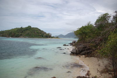 Scenic view of sea against cloudy sky