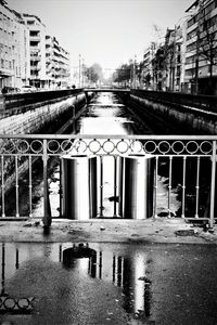 Reflection of building in puddle