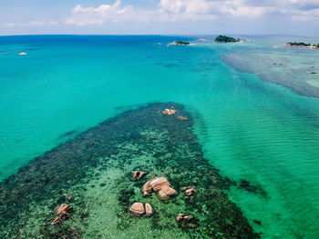 High angle view of sea shore against sky