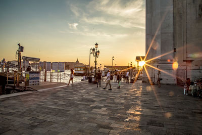 People on street at sunset