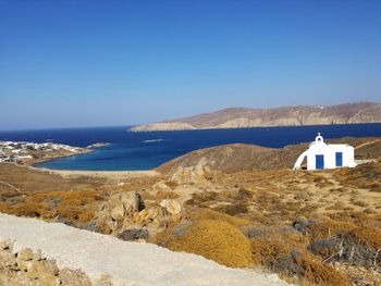 Scenic view of sea against clear blue sky