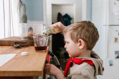 Boy and woman on table at home