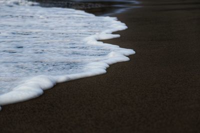 Close-up of snow on beach