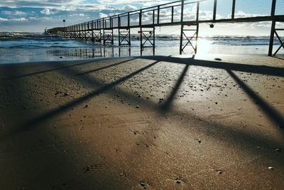 Shadow of people on beach