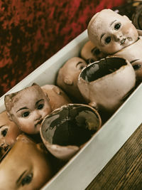 High angle view of broken masks on table