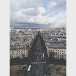 Cityscape against cloudy sky