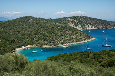 High angle view of sailboats by sea against sky