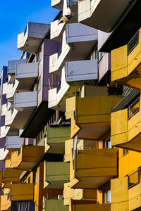 Low angle view of colourful building with prominent balconies in berlin