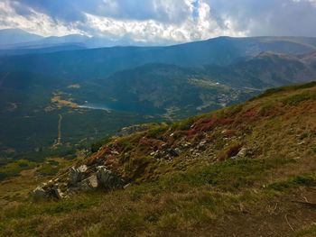 High angle view of mountains and sea against sky