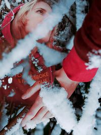 Double exposure portrait of woman covered with snow