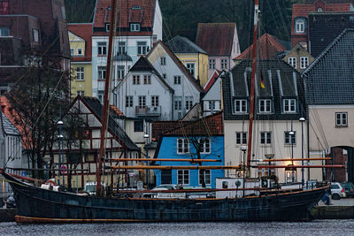 Boats moored at harbor