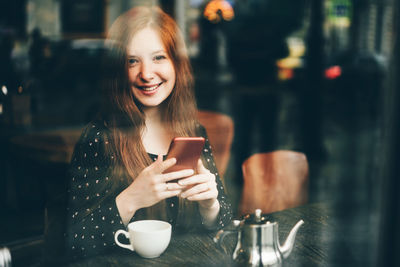 Young woman using mobile phone