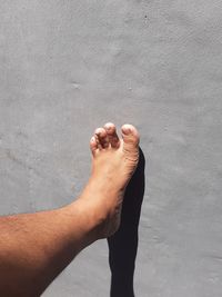 Low section of man standing on floor