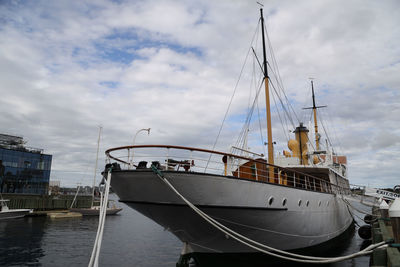 Boats moored at harbor