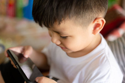 Close-up of boy looking at camera