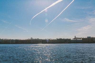 Scenic view of river against blue sky