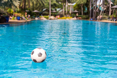 View of soccer ball in swimming pool